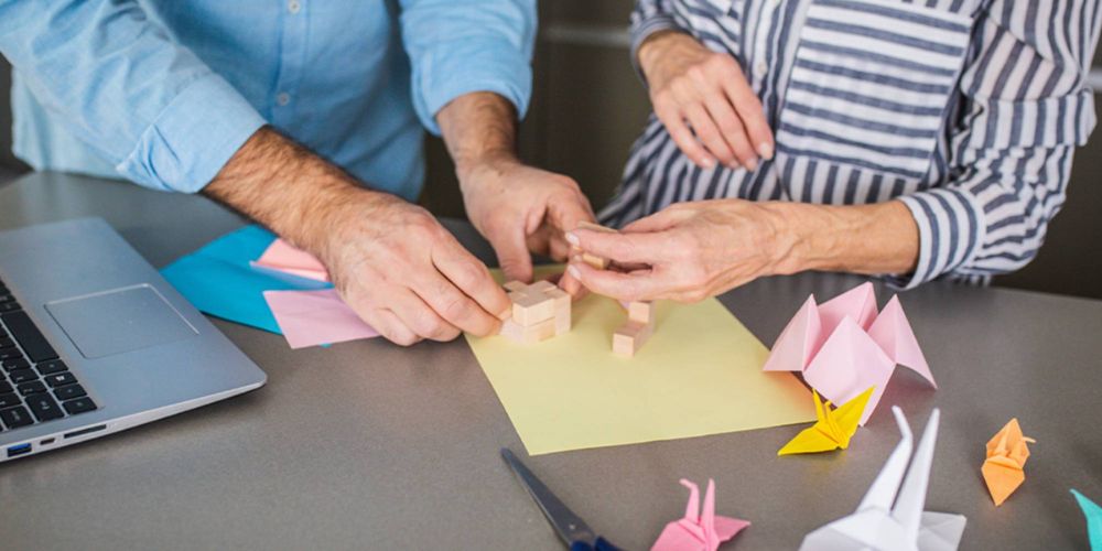 Caregiver gently guiding a senior’s hands
