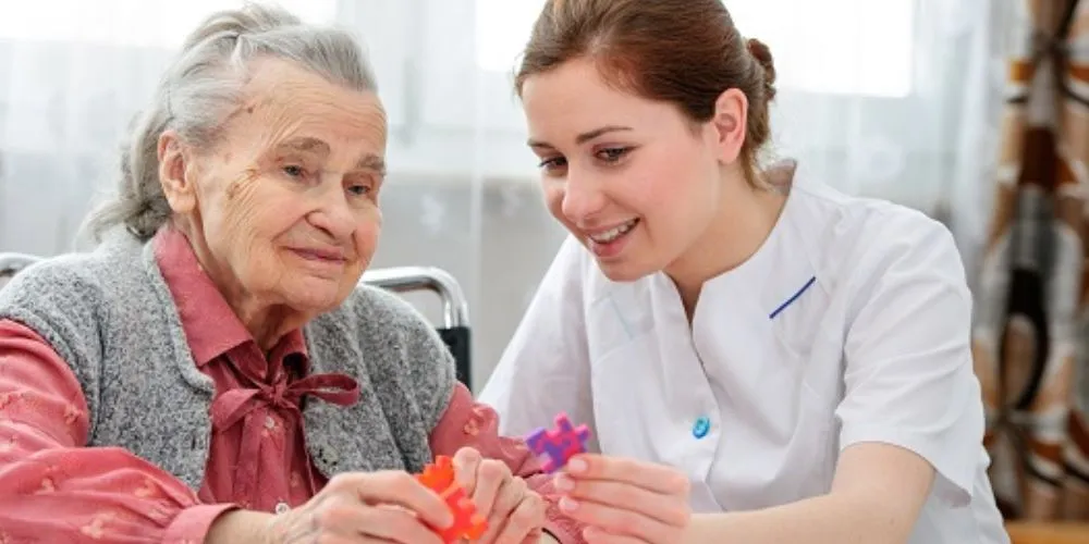 Caregiver working one-on-one with a senior