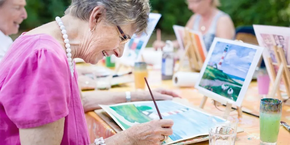 Senior enjoying painting, comfort and quality of life