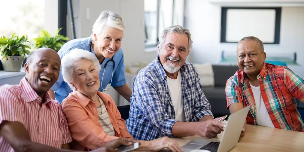 Seniors connecting with family over a laptop